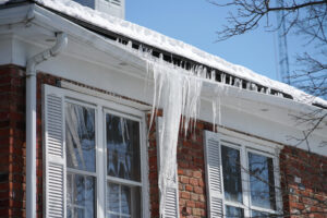 Ice Dams and Icicles Forming on The Gutters of a House | K-Guard St. Louis